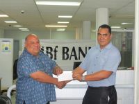 MBF Bank’s Head of Finance, Tevita Akoteu presents a $5,000 Cheque to Heilala Festival Director Hon. Semisi Sika