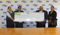 Acting General Manager of TCC Sione Veikoso presents to Hon. Minister of Tourism Semisi Sika sponsorship check of $5000 TOP