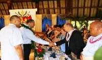 His Majesty King Tupou VI, King of Tonga, second from left, greets Eric Shumway, the former BYU–Hawaii and Polynesian Cultural Center president who holds the Tongan chiefly title Faivaola, during a banquet in the king and queen&#039;s honor. PCC president Alfred Grace is to the left; and Elder O. Vincent Haleck a General Authority Seventy and first counselor in the 
