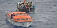  FV Losemani Fo&#039;ou towed by a life boat from the German cruise ship Albatros