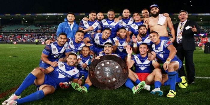 Samoa celebrate with the Pacific Test trophy after their hard-fought victory over Tonga