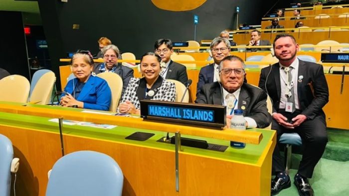 Marshall Islands Ambassador to the United Nations John Silk, seated at right with members of the Marshall Islands delegation, in the General Assembly hall in New York last October following the country&#039;s election to the UN Human Rights Council. 