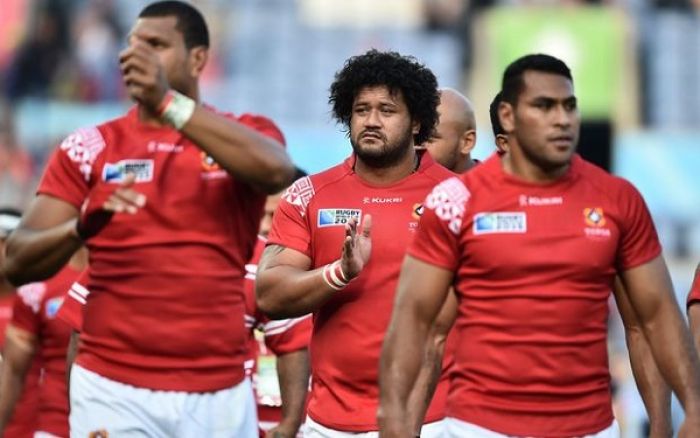 onga players thank the crowd following their Rugby World Cup defeat to Argentina. Photo: AFp