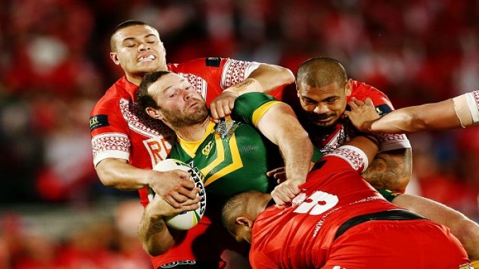 Boyd Cordner of Australia is tackled by Tuimoala Lolohea and Sika Manu of Tonga during the Test between Tonga and Australia in October last year