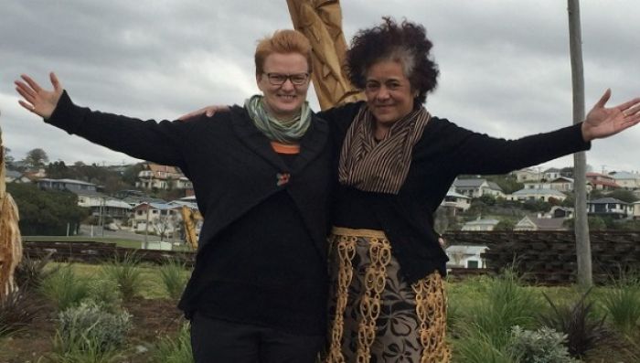 Reverend of the Eveline Church Jill McDonald, left, and the president of Waitaki Tongan Community Talanoa Palu at Friendly Bay in front of the sculpted trees they had landscaped as part of a fundraiser.