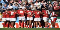 The Tongan team huddle together following their Rugby World Cup defeat to Argentina. Photo: AFP