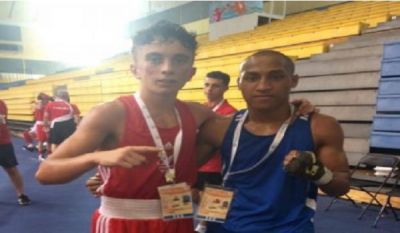 John Paul Wilson, Wales (left) with Tu’ihalangingie Vea of Tonga (56kg)