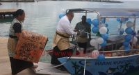 Deputy Prime Minister Hon Siaosi Sovaleni cuts the ribbion to mark the launching of R2R marine monitoring boat. Photo: MEIDECC