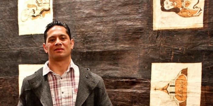 Visesio Siasau in front of his work Tongan Tapa Cloth, which won this year&#039;s Wallace Arts Trust Paramount Award (photo by NZ Herald).