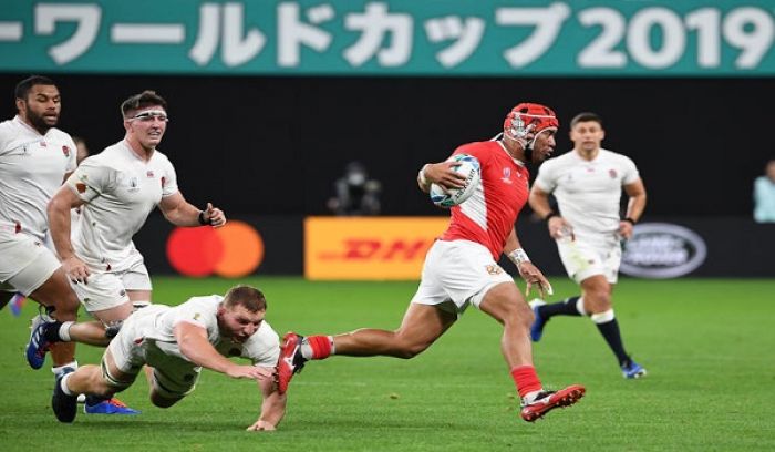 Captain Siale Piutau makes a rare break for Tonga.